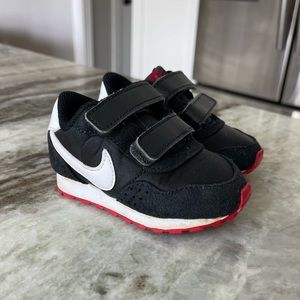 3.5C Nike Sneakers. Black, white and red. Hardly worn, like new.